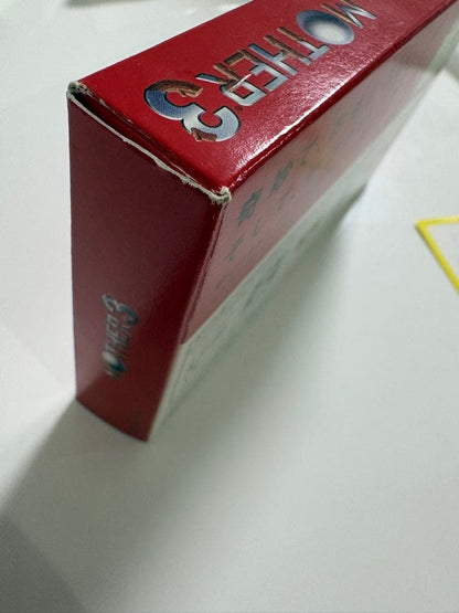 Game Boy Advance MOTHER3 game cartridge with original box and manual showing signs of aging and storage damage