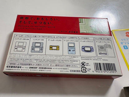 Game Boy Advance MOTHER3 game cartridge with original box and manual showing signs of aging and storage damage