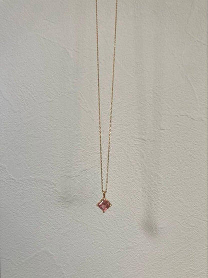 10K gold necklace with a pink agate diamond-shaped pendant measuring 9 mm stone and 13 mm top size