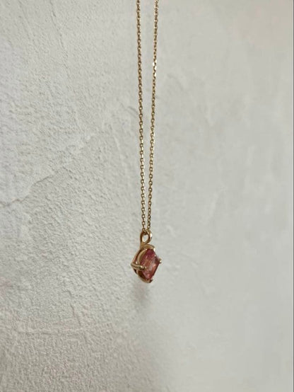 10K gold necklace with a pink agate diamond-shaped pendant measuring 9 mm stone and 13 mm top size