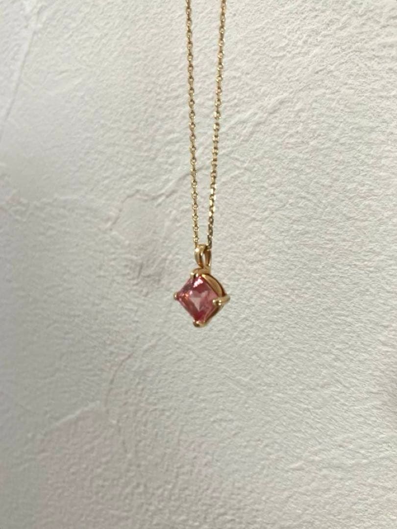 10K gold necklace with a pink agate diamond-shaped pendant measuring 9 mm stone and 13 mm top size