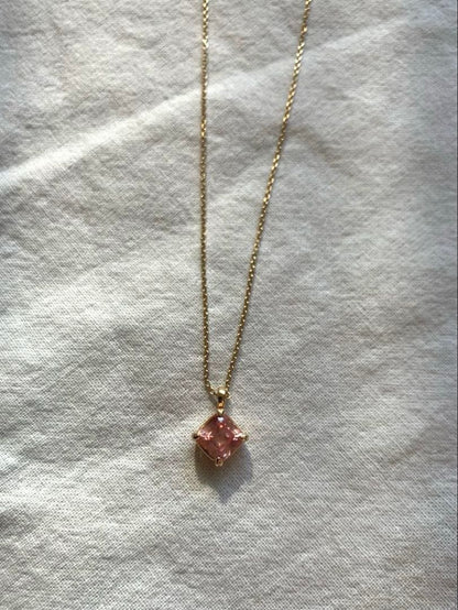 10K gold necklace with a pink agate diamond-shaped pendant measuring 9 mm stone and 13 mm top size