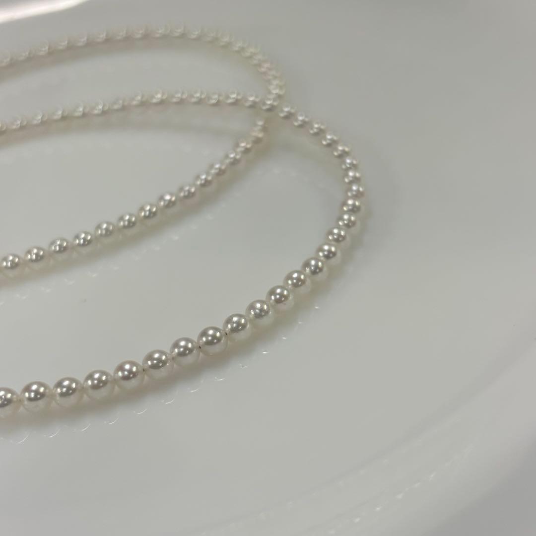 Uncolored Akoya pearl necklace with 3-3.5mm baby pearls and 42cm length featuring a 925 clasp