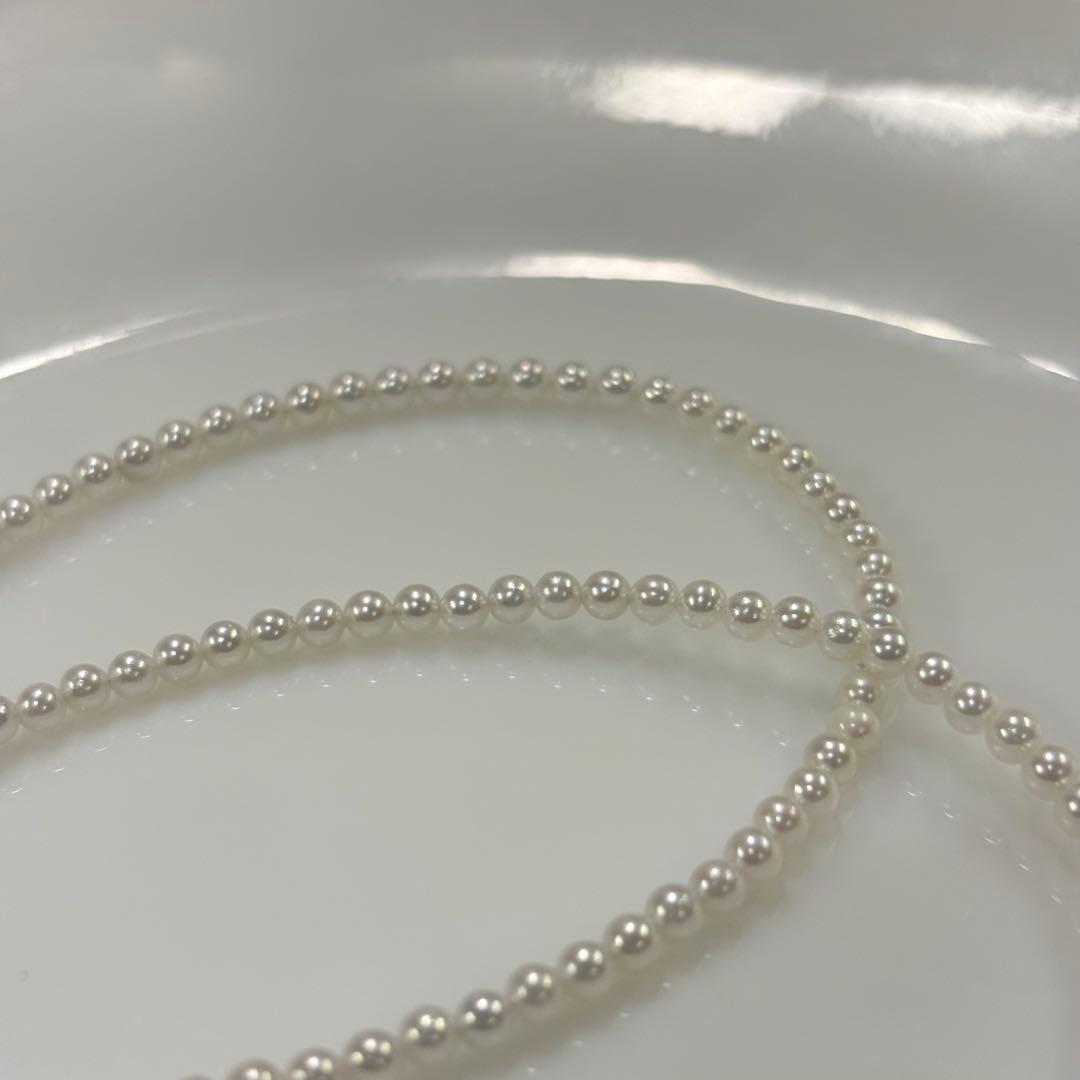Uncolored Akoya pearl necklace with 3-3.5mm baby pearls and 42cm length featuring a 925 clasp