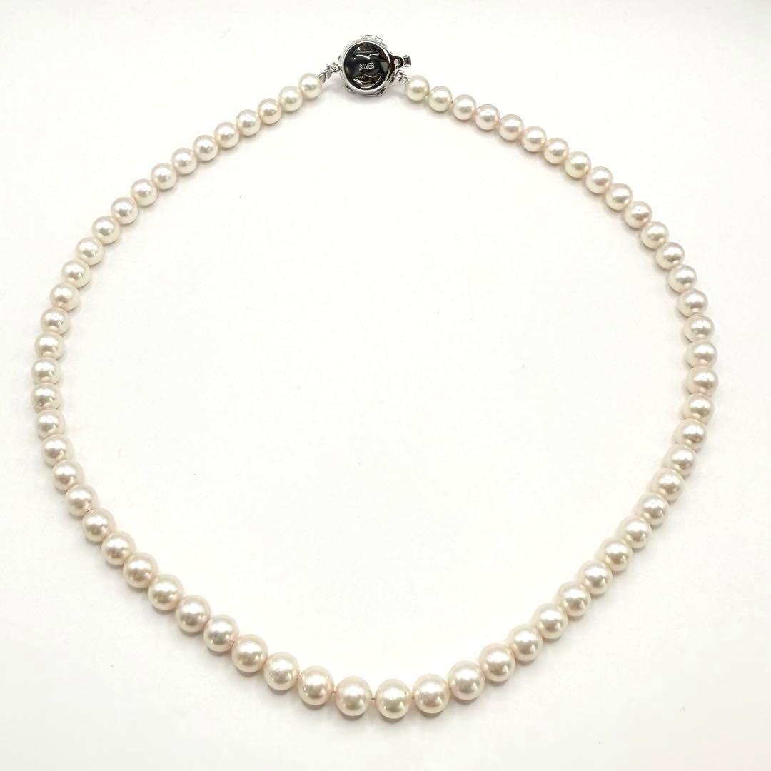 Yamato Akoya pearl necklace with 6mm pearls measuring 42cm displayed on a white background