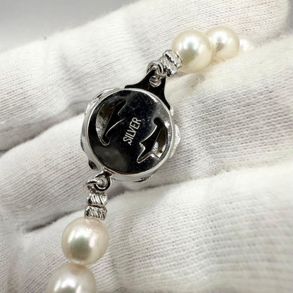 Yamato Akoya pearl necklace with 6mm pearls measuring 42cm displayed on a white background