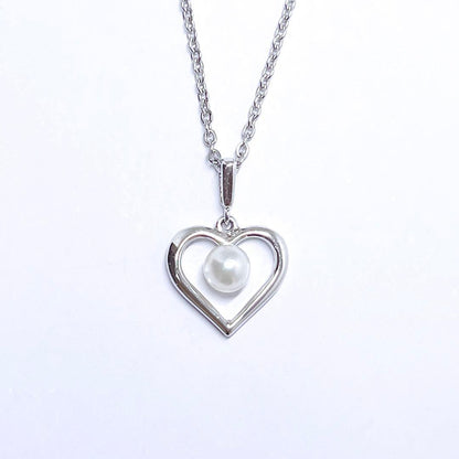 Mikimoto pearl necklace with 4.4mm pearls and silver heart pendant on a 39cm chain