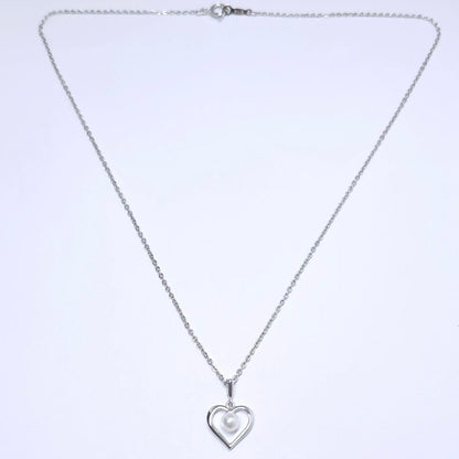 Mikimoto pearl necklace with 4.4mm pearls and silver heart pendant on a 39cm chain