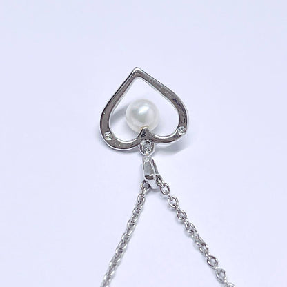 Mikimoto pearl necklace with 4.4mm pearls and silver heart pendant on a 39cm chain