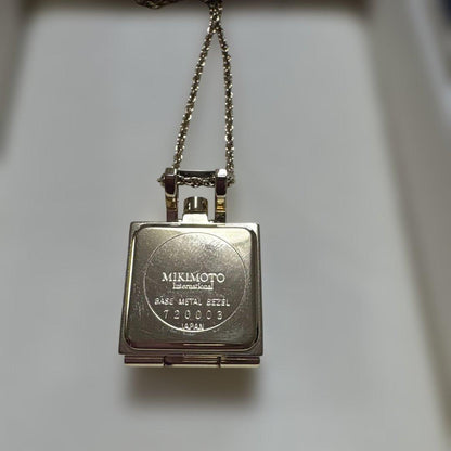 MIKIMOTO pearl pendant in gold tone featuring a single lustrous pearl on a delicate chain