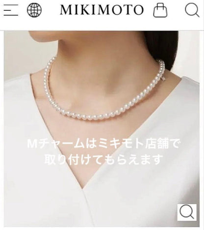 Mikimoto baby pearl necklace with 6 to 6.5 mm pearls, silver clasp engraved Mikimoto, displayed with case