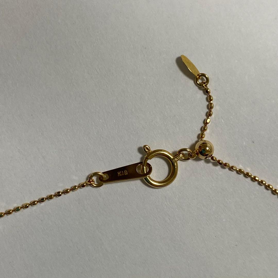 K18YG Akoya Pearl Y-shaped Necklace with cut ball chain and two Akoya pearls, one movable, on white background