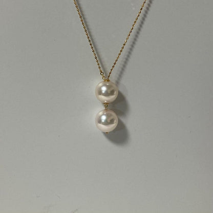 K18YG Akoya Pearl Y-shaped Necklace with cut ball chain and two Akoya pearls, one movable, on white background