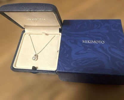 MIKIMOTO K18WG necklace with a single white pearl pendant on a delicate white gold chain