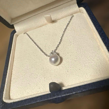 MIKIMOTO K18WG necklace with a single white pearl pendant on a delicate white gold chain