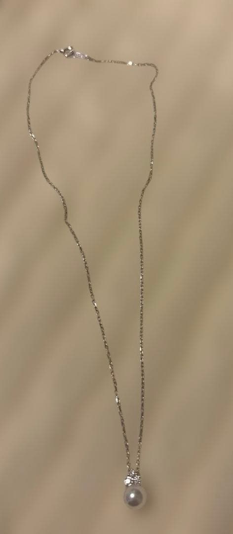 MIKIMOTO K18WG necklace with a single white pearl pendant on a delicate white gold chain