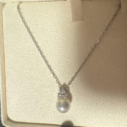 MIKIMOTO K18WG necklace with a single white pearl pendant on a delicate white gold chain