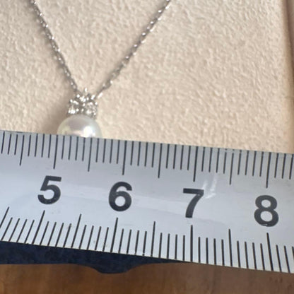 MIKIMOTO K18WG necklace with a single white pearl pendant on a delicate white gold chain
