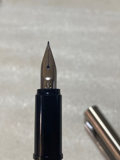 Pilot fountain pen and mechanical pencil set with sleek black barrels and silver accents