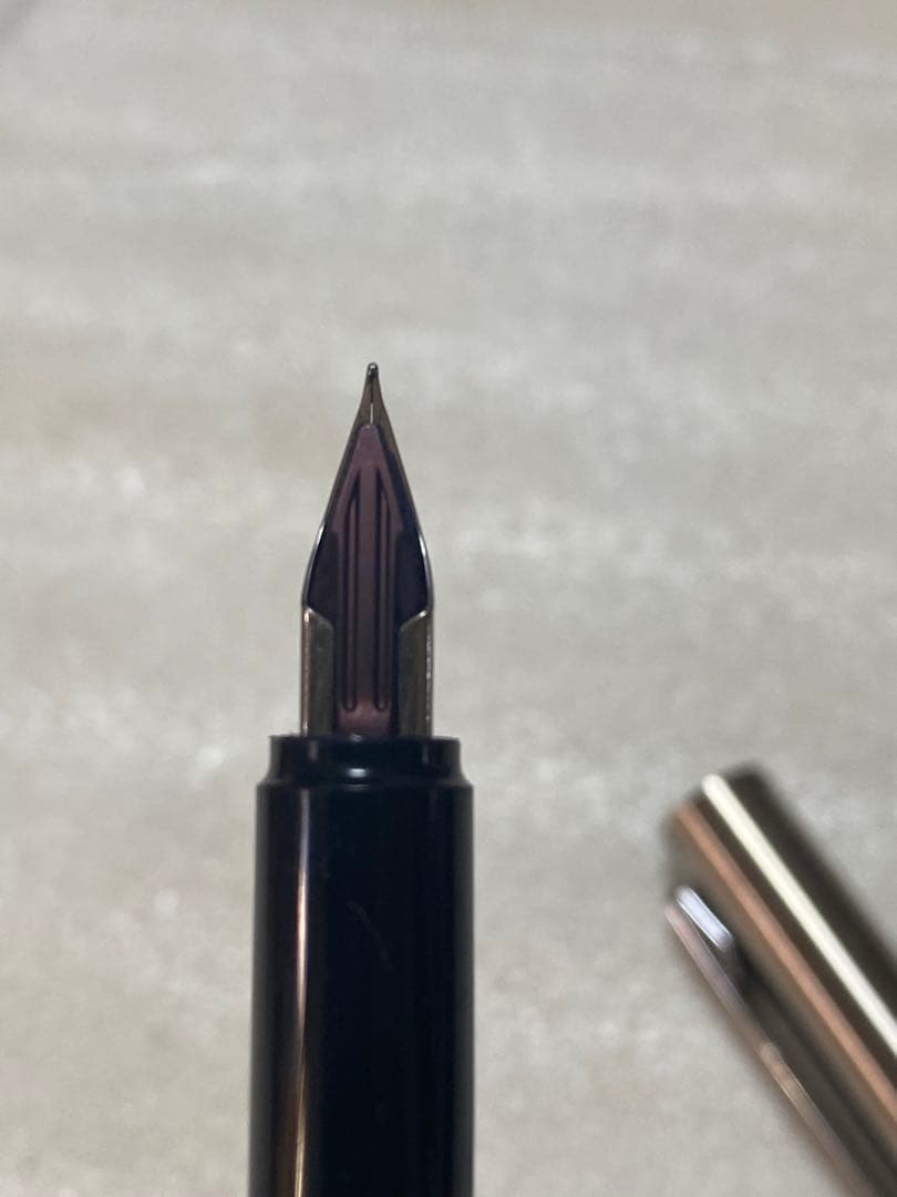 Pilot fountain pen and mechanical pencil set with sleek black barrels and silver accents