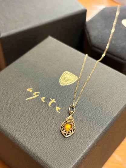 Agete K10 Multi-Stone Charm Necklace with yellow garnet and shell charms on a 45cm yellow gold chain