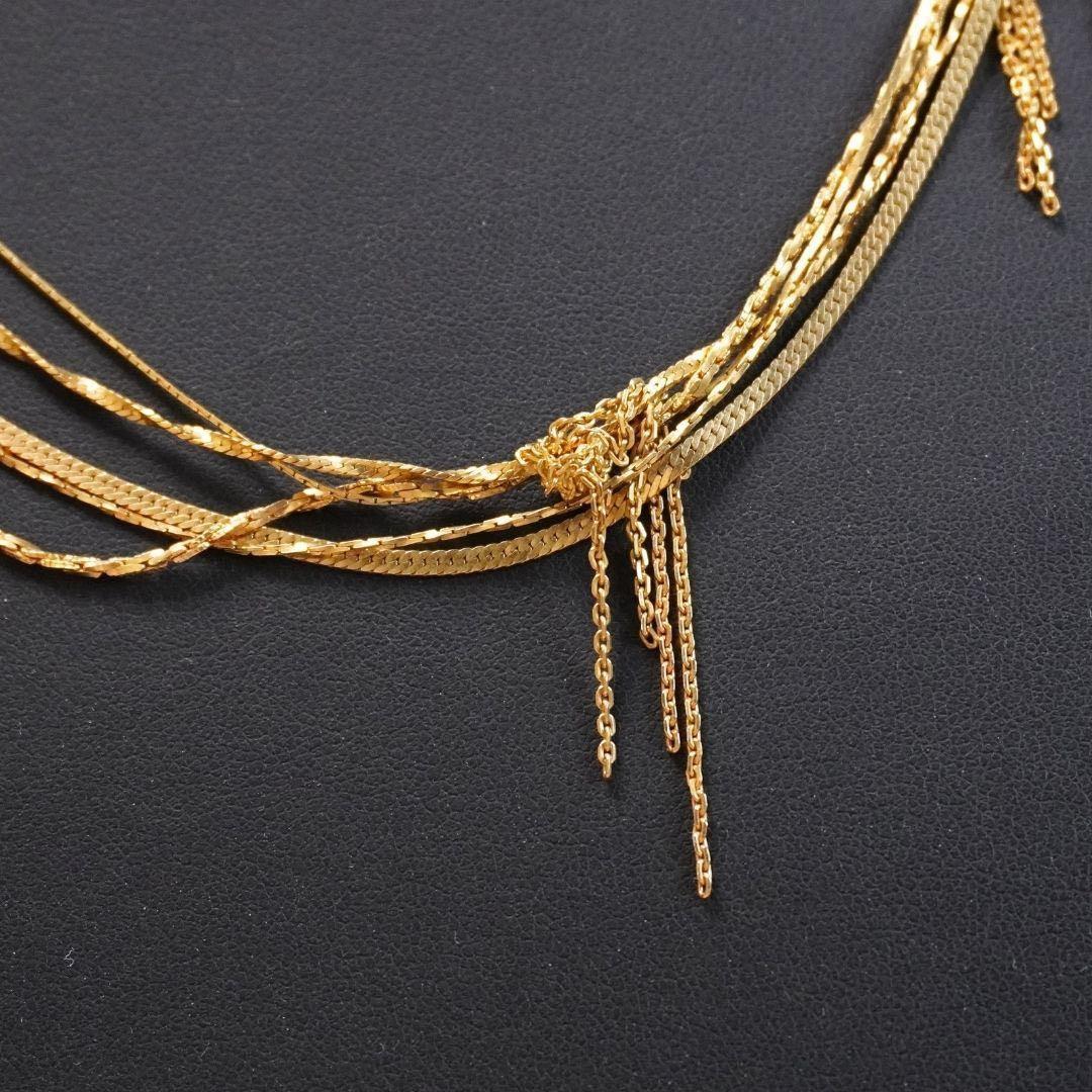 Agete 5-row gold necklace with long adjustable chain showing its length and clasp