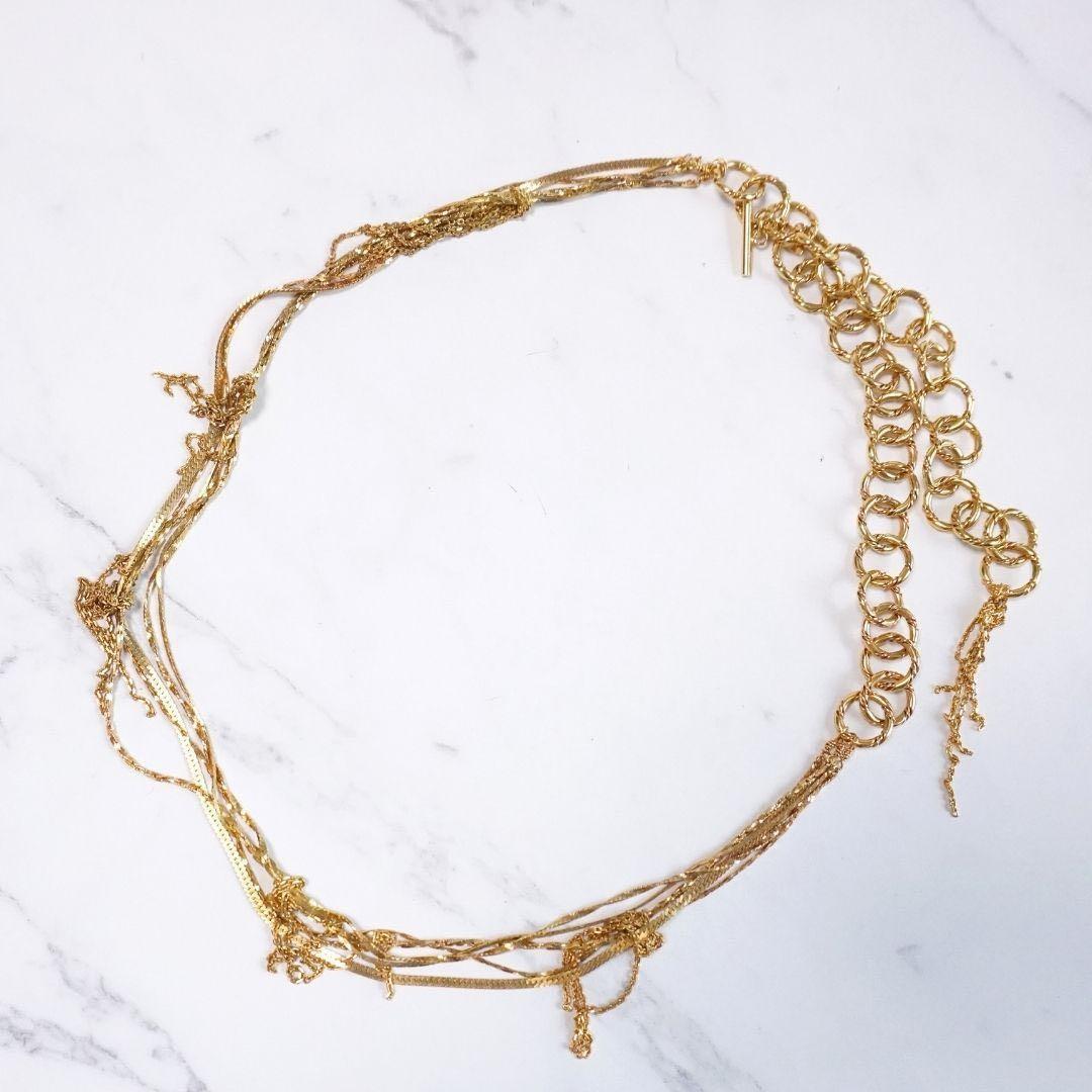 Agete 5-row gold necklace with long adjustable chain showing its length and clasp