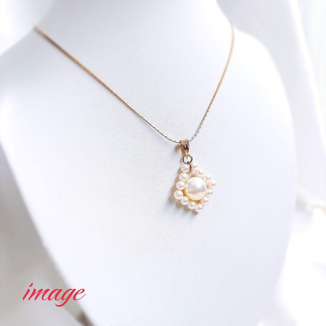 TASAKI K18 gold pearl necklace top featuring a 12mm Mabe pearl and 13 small 4.5mm Akoya pearls