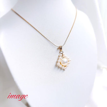 TASAKI K18 gold pearl necklace top featuring a 12mm Mabe pearl and 13 small 4.5mm Akoya pearls