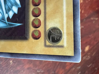Spell of Mask Blue Eyes White Dragon Ultimate Rare Old Relic card with minor surface and corner damage