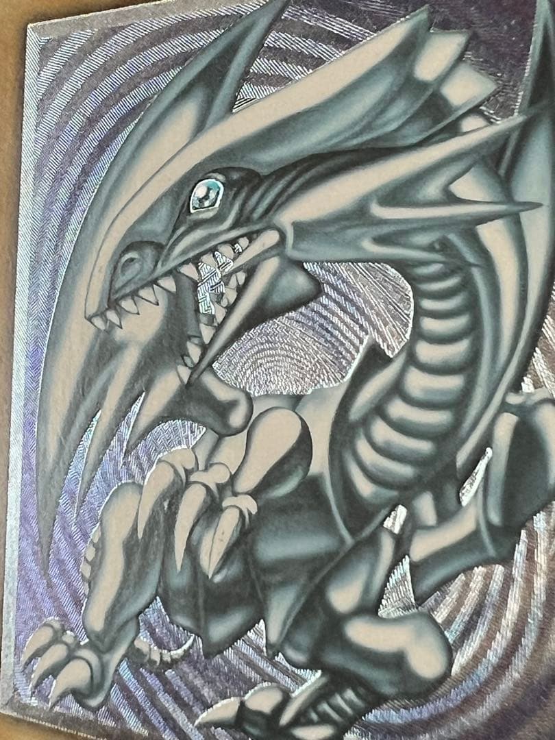 Spell of Mask Blue Eyes White Dragon Ultimate Rare Old Relic card with minor surface and corner damage