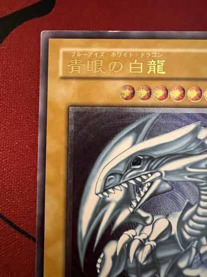 Spell of Mask Blue Eyes White Dragon Ultimate Rare Old Relic card with minor surface and corner damage