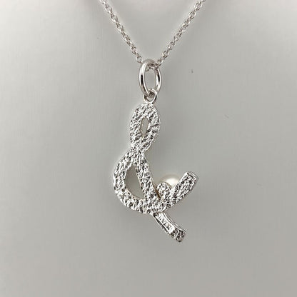TASAKI Pearl Necklace in silver with 42cm adjustable chain and delicate pearl pendant