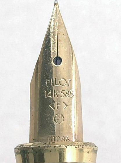 Pilot fountain pen with 14K gold fine nib, sleek black barrel, and silver clip made in Japan