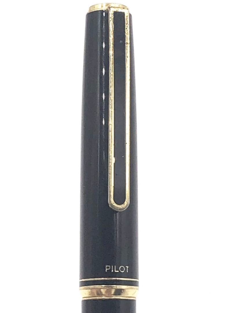 Pilot fountain pen with 14K gold fine nib, sleek black barrel, and silver clip made in Japan