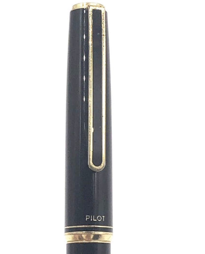 Pilot fountain pen with 14K gold fine nib, sleek black barrel, and silver clip made in Japan