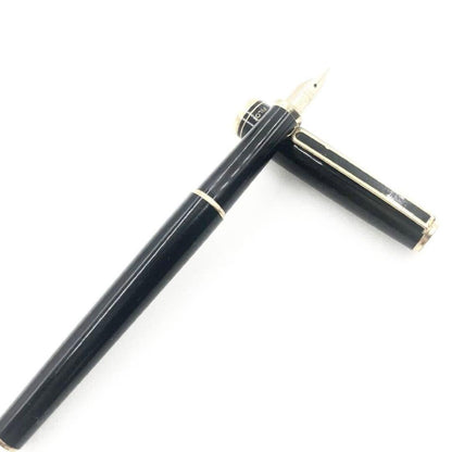 Pilot fountain pen with 14K gold fine nib, sleek black barrel, and silver clip made in Japan