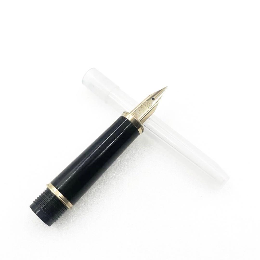 Pilot fountain pen with 14K gold fine nib, sleek black barrel, and silver clip made in Japan