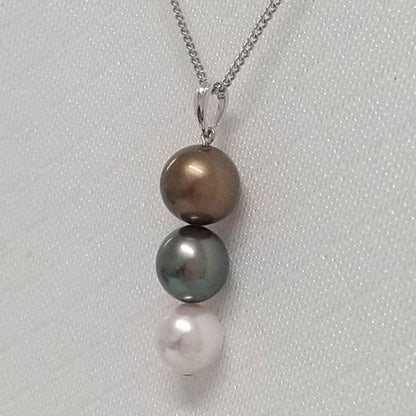 Law pendant with three round Tahiti black and Akoya pearls in varying colors on a service chain