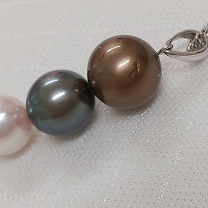 Law pendant with three round Tahiti black and Akoya pearls in varying colors on a service chain