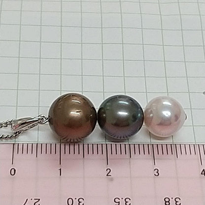 Law pendant with three round Tahiti black and Akoya pearls in varying colors on a service chain