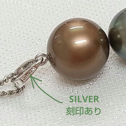 Law pendant with three round Tahiti black and Akoya pearls in varying colors on a service chain