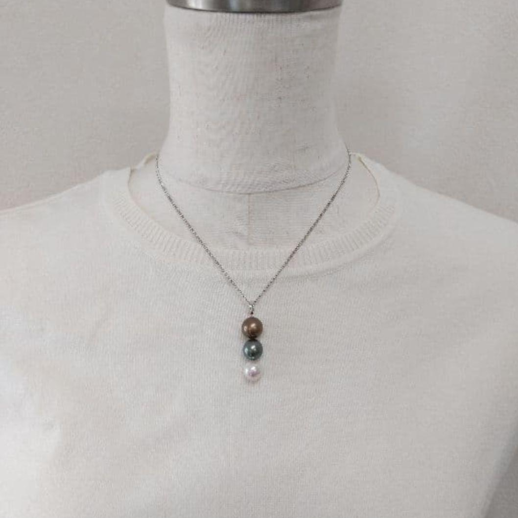 Law pendant with three round Tahiti black and Akoya pearls in varying colors on a service chain