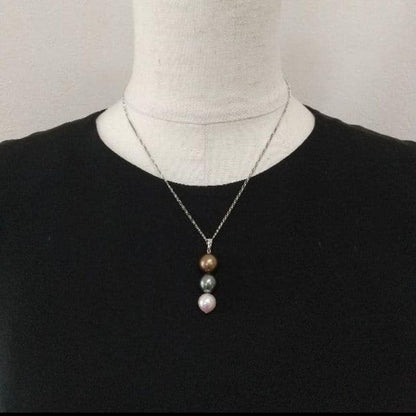 Law pendant with three round Tahiti black and Akoya pearls in varying colors on a service chain
