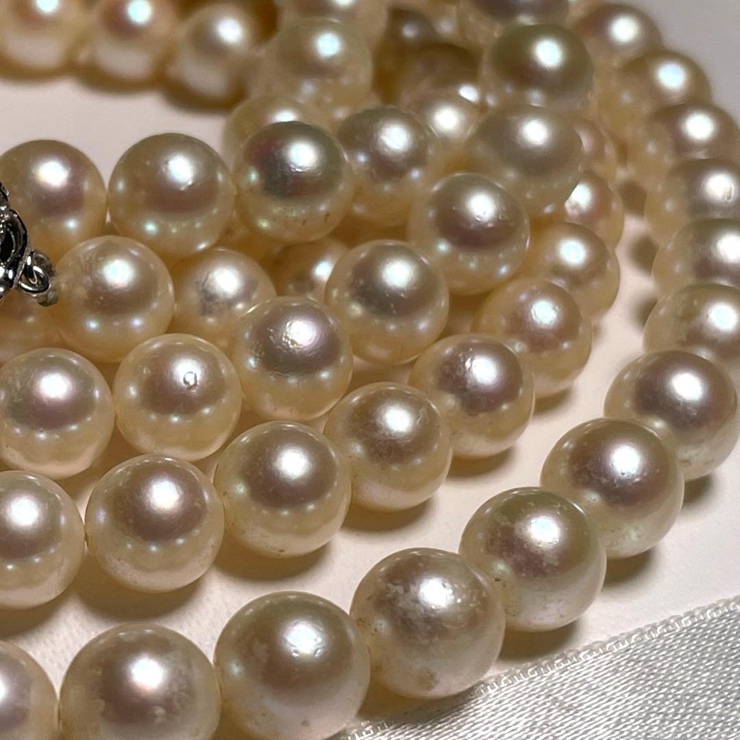 Akoya pearl long necklace with round white pearls 6.9-7.4mm in tsumami style on a silvery chain