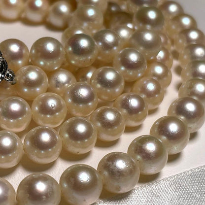 Akoya pearl long necklace with round white pearls 6.9-7.4mm in tsumami style on a silvery chain