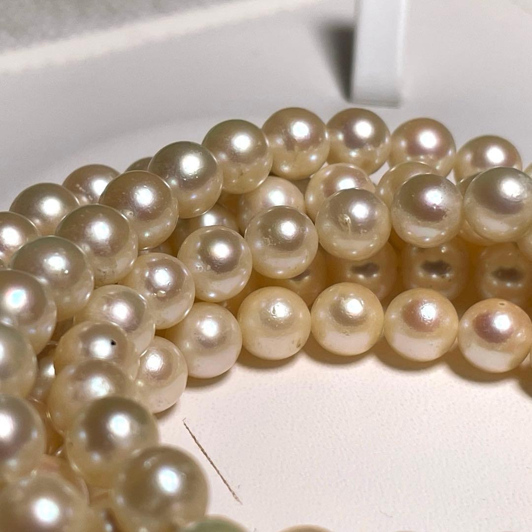 Akoya pearl long necklace with round white pearls 6.9-7.4mm in tsumami style on a silvery chain