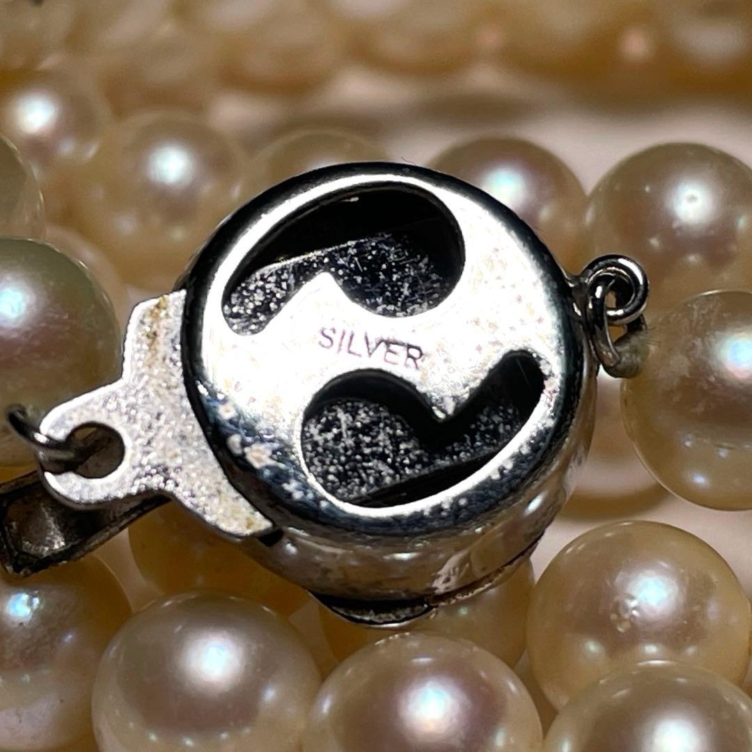 Akoya pearl long necklace with round white pearls 6.9-7.4mm in tsumami style on a silvery chain