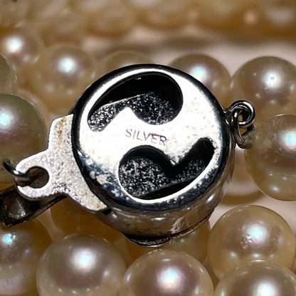 Akoya pearl long necklace with round white pearls 6.9-7.4mm in tsumami style on a silvery chain