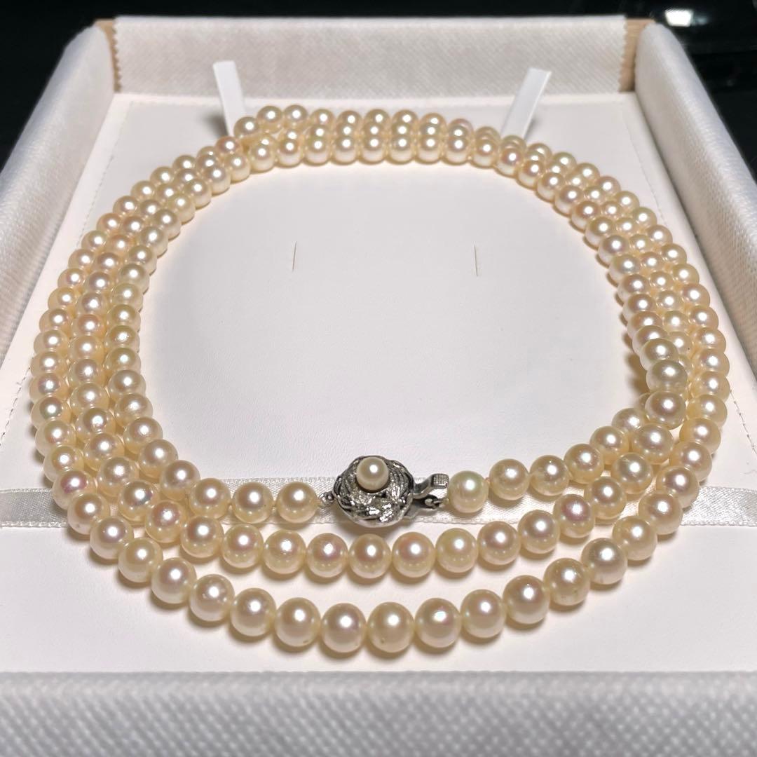 Akoya pearl long necklace with round white pearls 6.9-7.4mm in tsumami style on a silvery chain